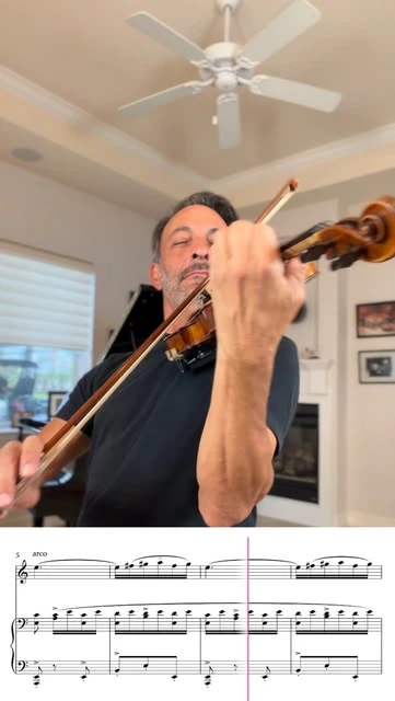 Richard playing violin with musical notation shown beneath him